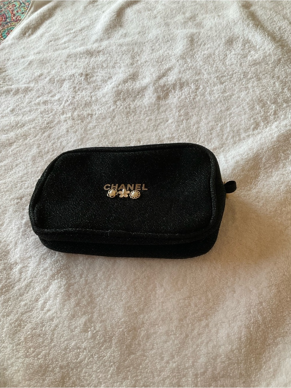 CHANEL Black Cosmetic Pouch with Gold Logo and Camellia Accents
